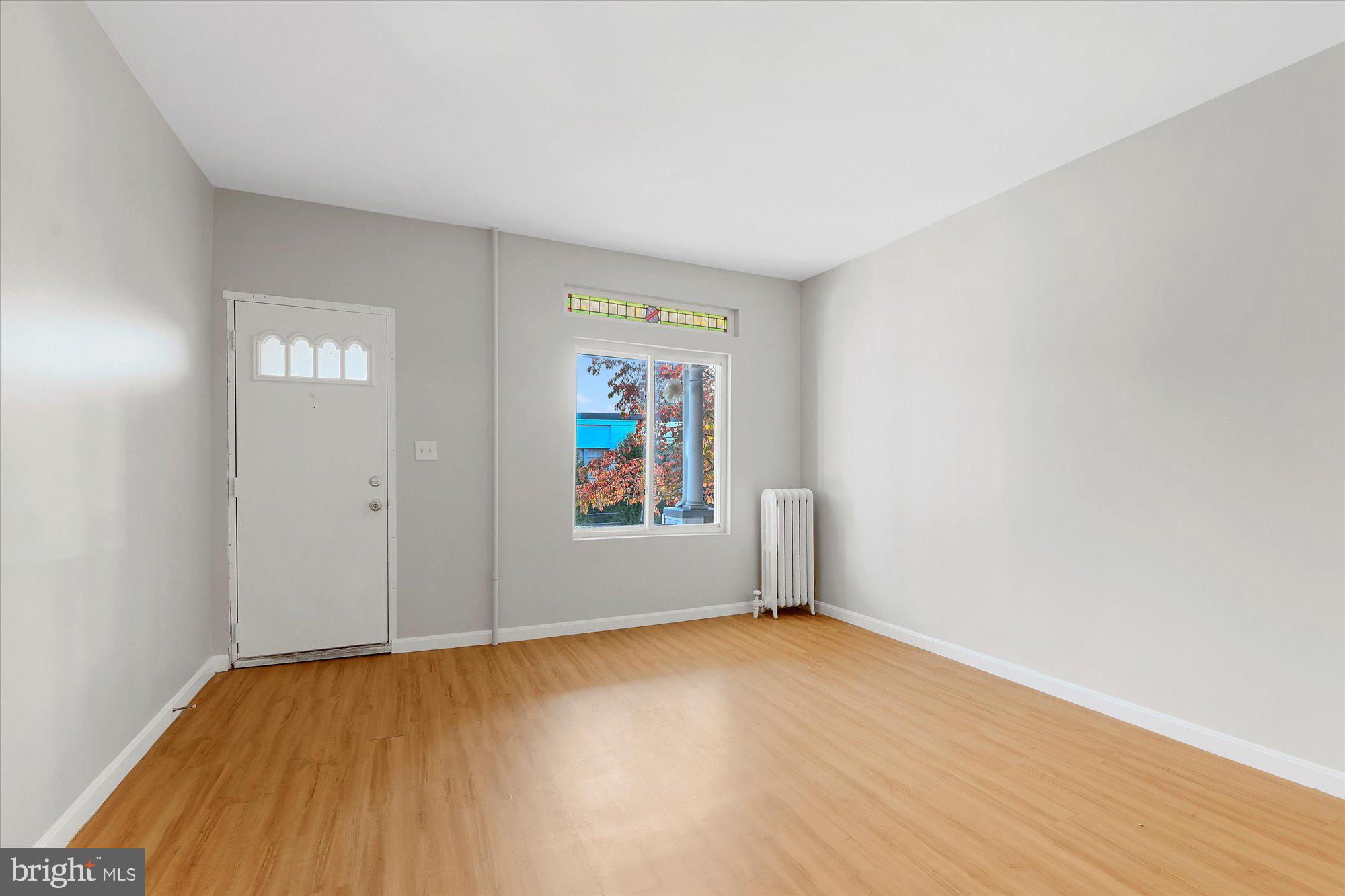 3660 Keswick Road Baltimore, MD 21211 - Photo 4 of 23 Gleaming hardwood floors and stain glass window