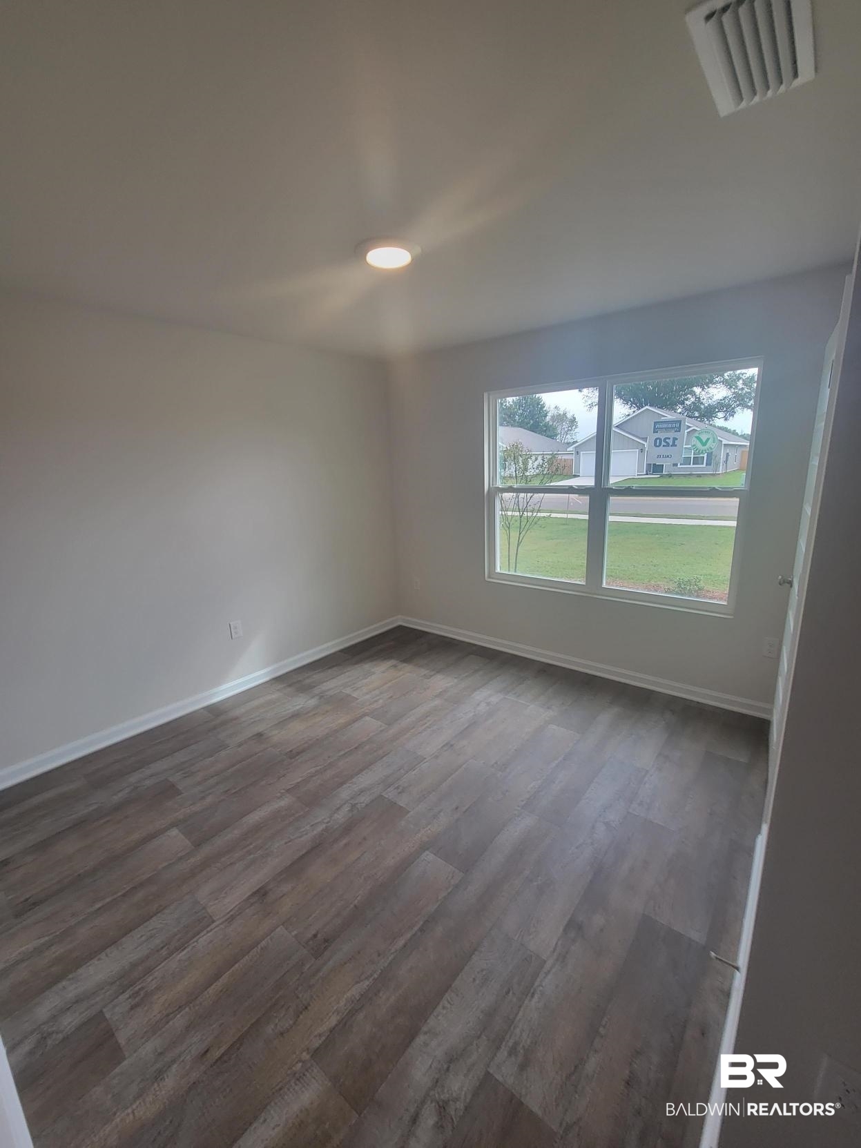 24625 Ponder Loop Loxley, AL 36551 - Photo 28 of 30 Unfurnished room with dark hardwood / wood-style flooring