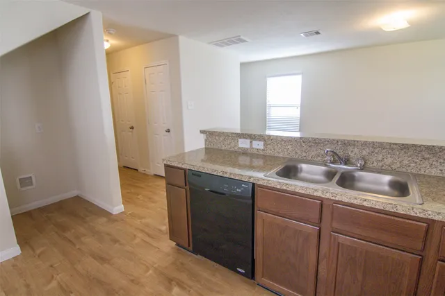 a view with a sink and mirror