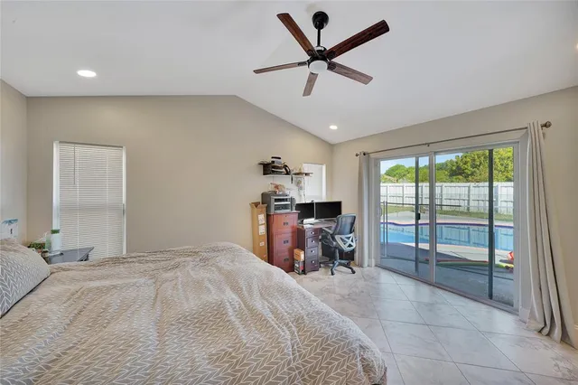 a very nice looking room with a large window and a chandelier