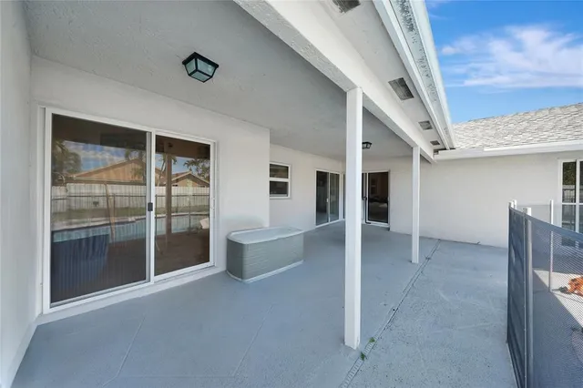 a view of a swimming pool with an outdoor seating