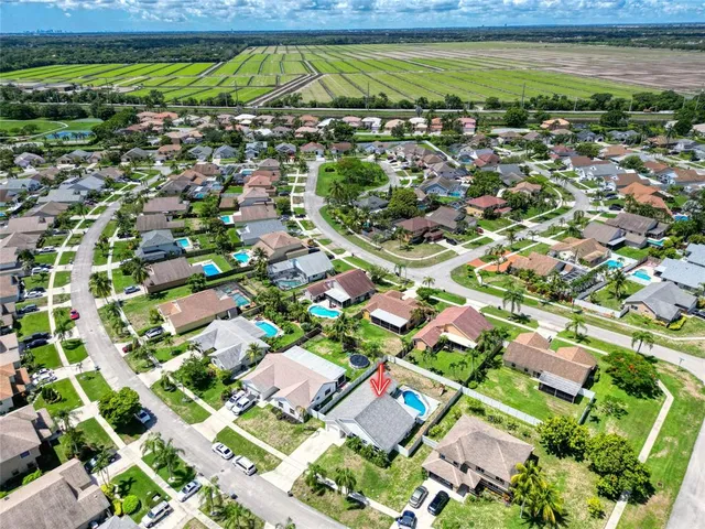 an aerial view of a house with garden space sitting space
