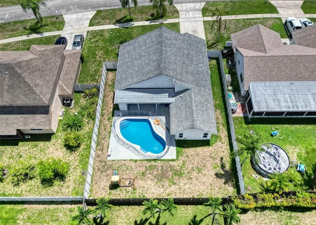 an aerial view of a house with a garden