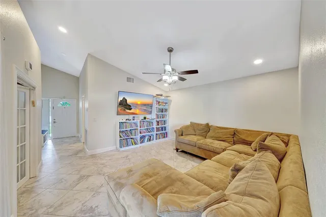 a bed room with a bed and a large window