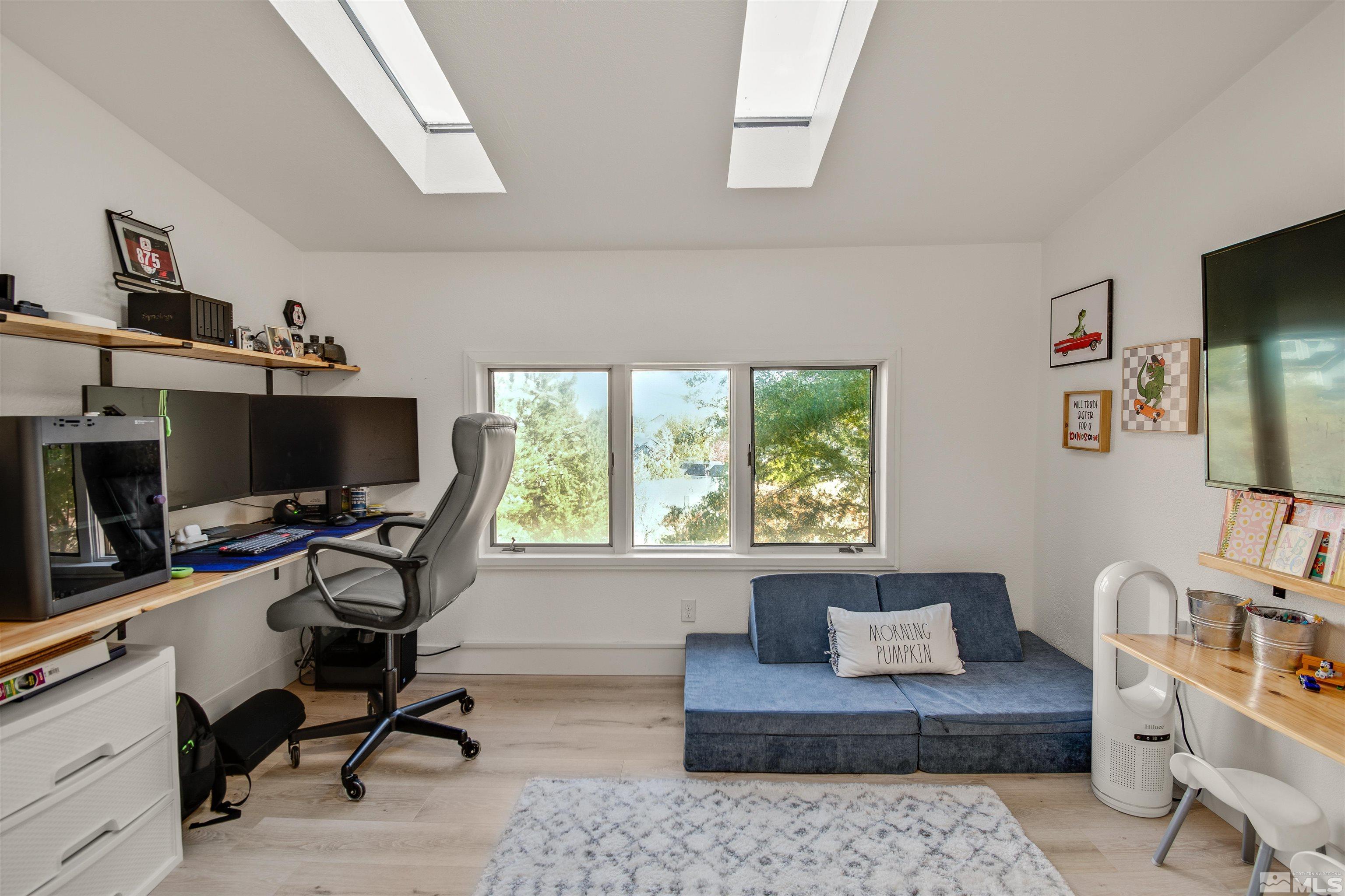 3961 Kings Row Reno, NV 89503 - Photo 11 of 25 a livingroom with workspace and a window