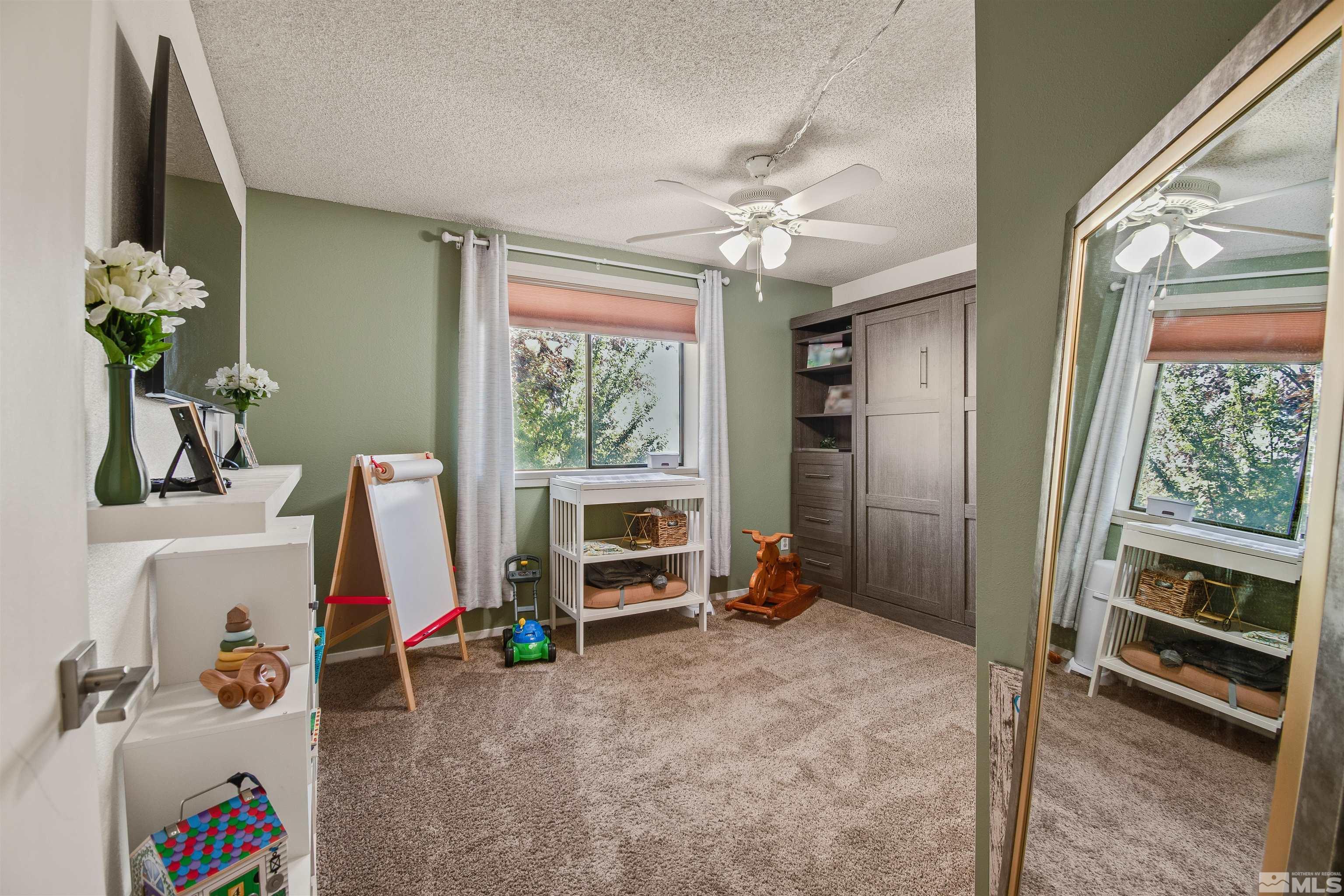3961 Kings Row Reno, NV 89503 - Photo 12 of 25 a view of a workspace with furniture and a window