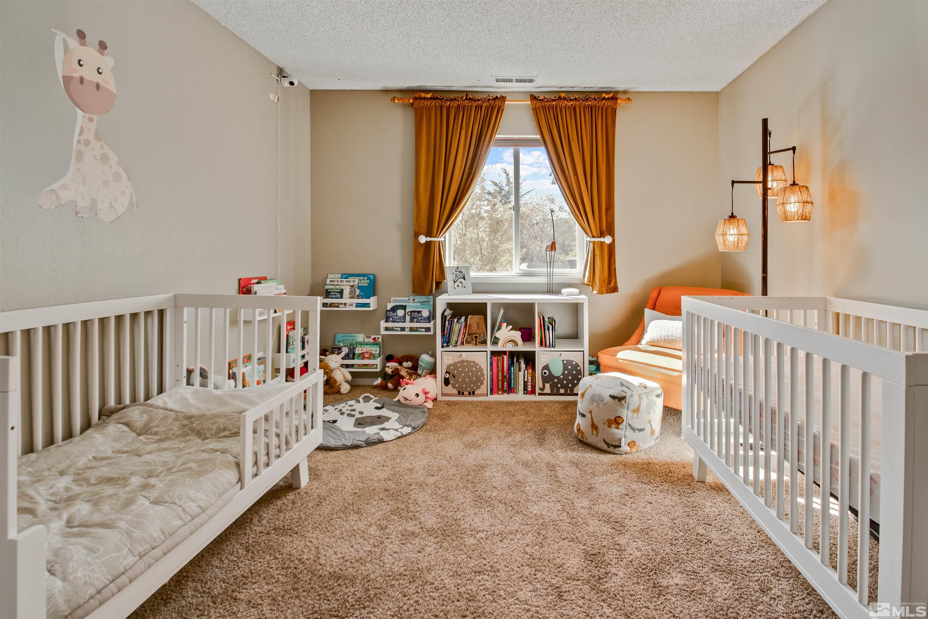 3961 Kings Row Reno, NV 89503 - Photo 17 of 25 a bedroom with furniture and a large window