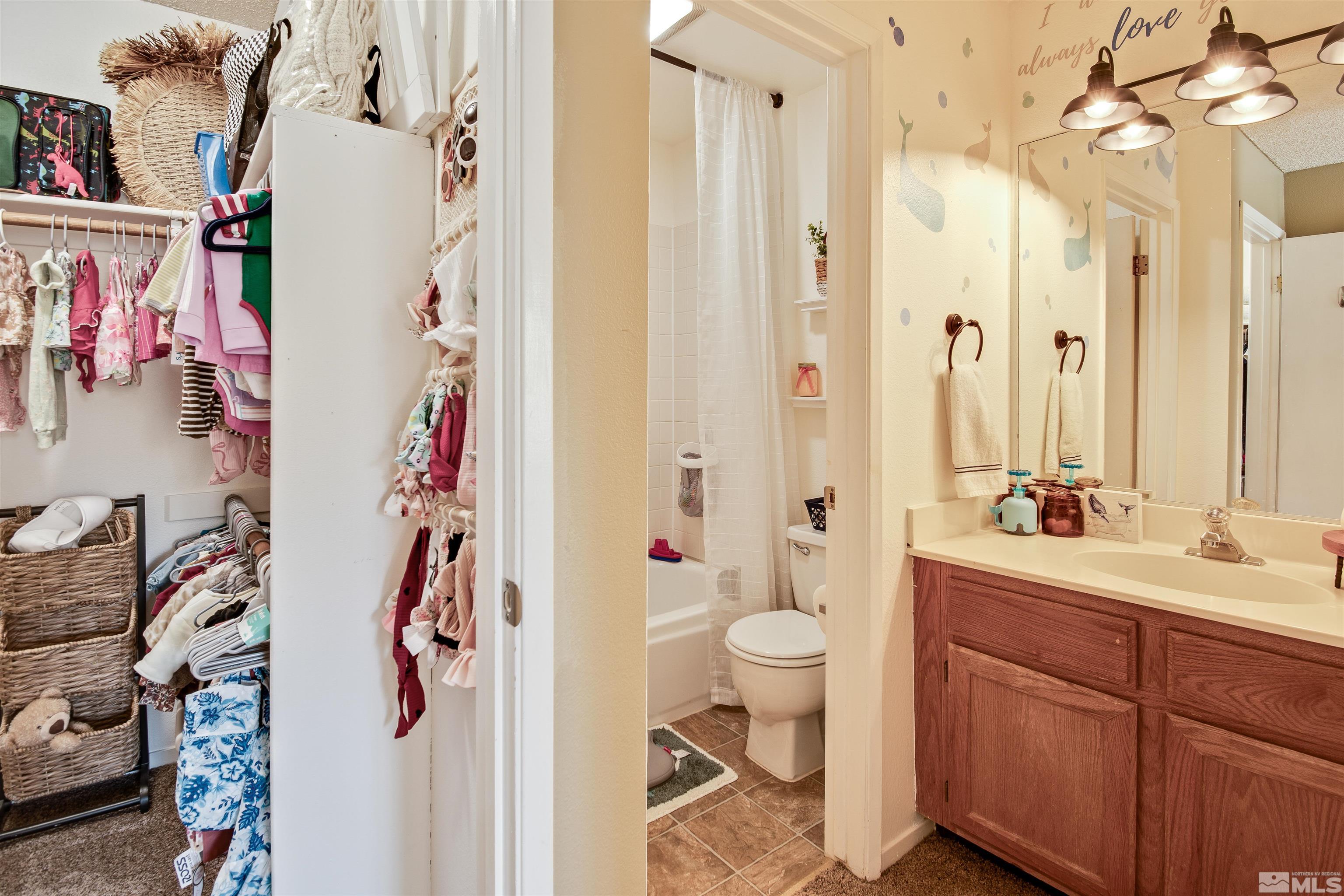3961 Kings Row Reno, NV 89503 - Photo 18 of 25 a bathroom with a sink vanity mirror and toilet
