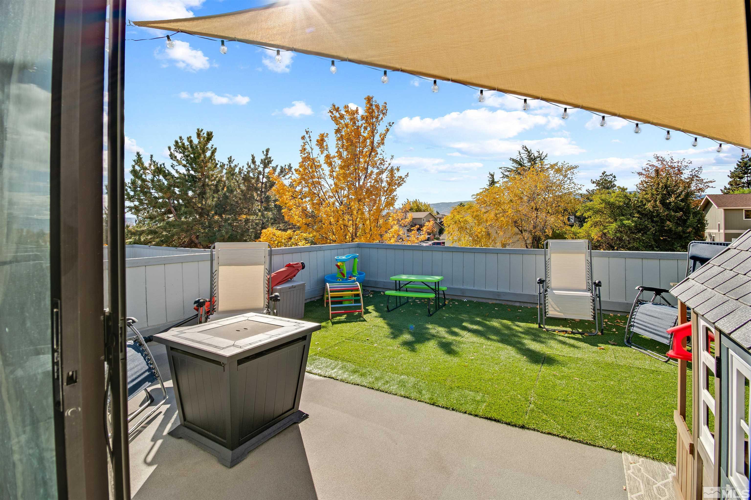 3961 Kings Row Reno, NV 89503 - Photo 21 of 25 a view of a chairs and table in backyard
