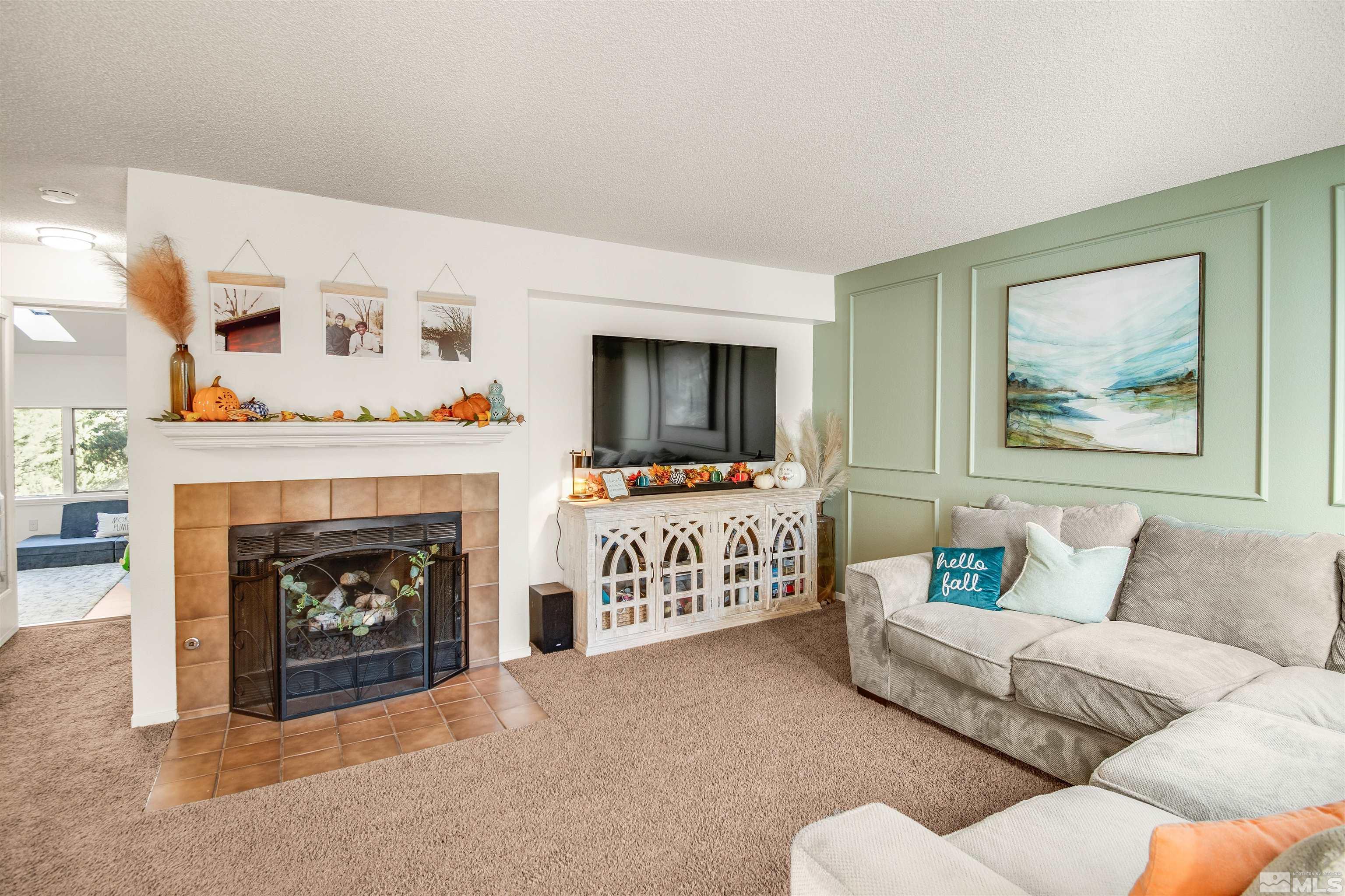 3961 Kings Row Reno, NV 89503 - Photo 4 of 25 a living room with furniture and a fireplace