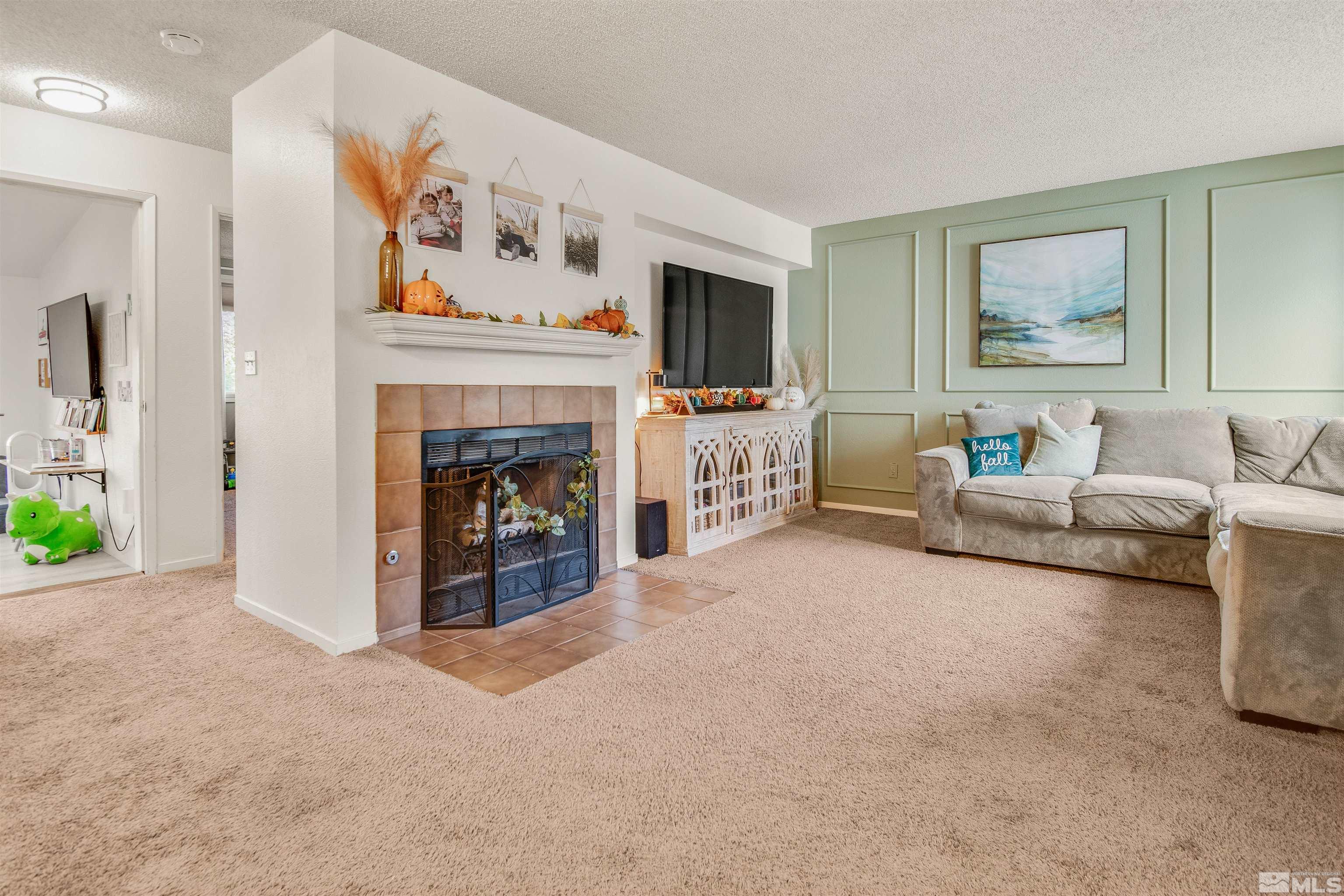 3961 Kings Row Reno, NV 89503 - Photo 5 of 25 a living room with furniture and a fireplace