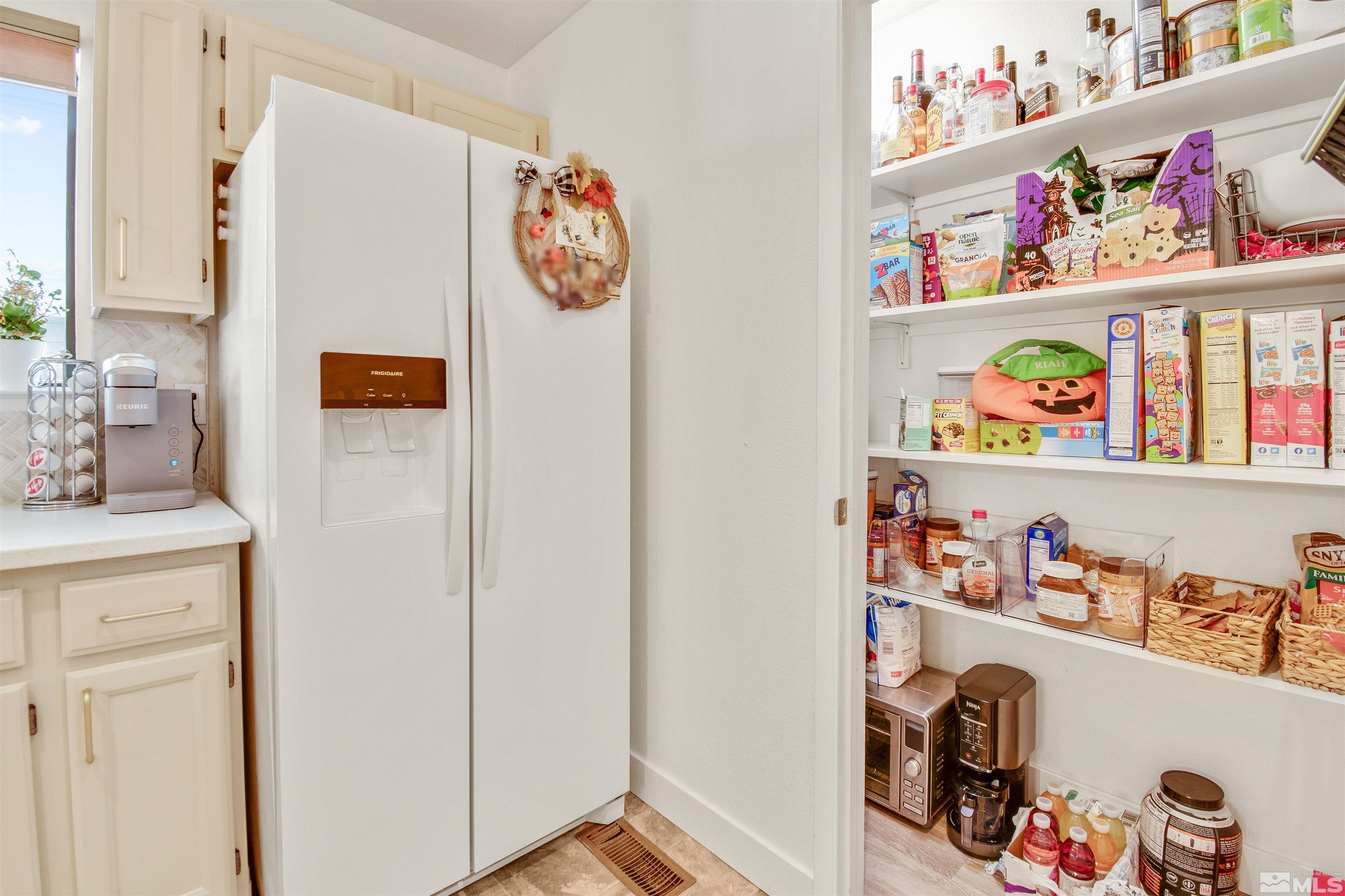 3961 Kings Row Reno, NV 89503 - Photo 8 of 25 a utility room with lots of clutter and cabinets