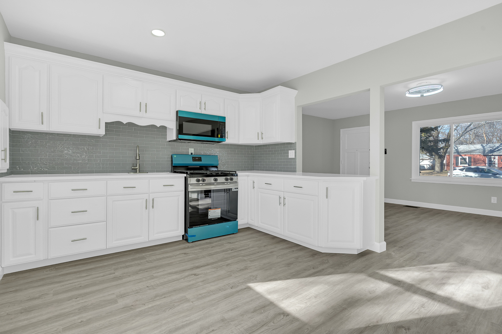 104 Louis Road Joliet, IL 60433 - Photo 6 of 11 a kitchen with stainless steel appliances a stove top oven and a refrigerator