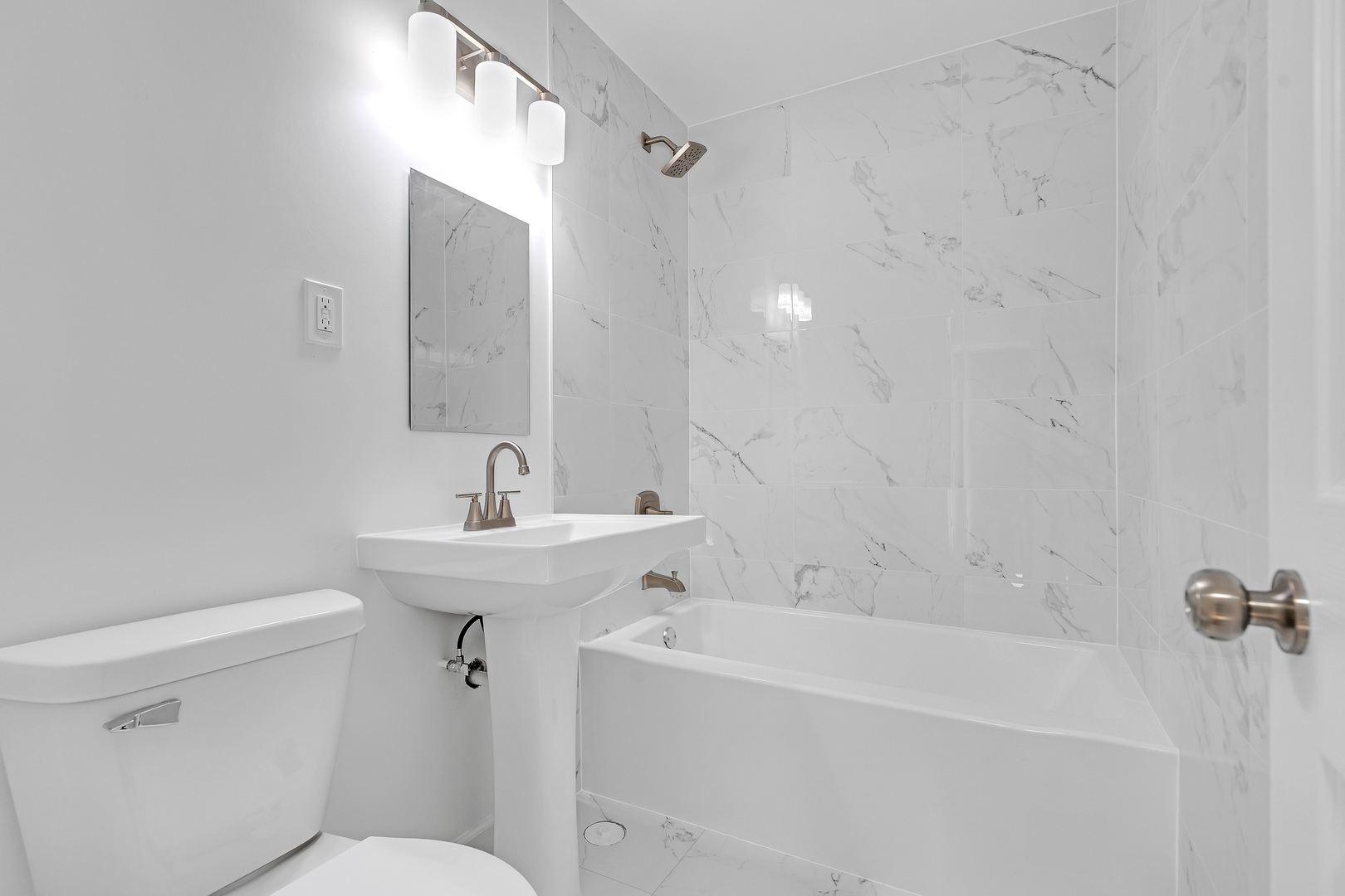 104 Louis Road Joliet, IL 60433 - Photo 7 of 11 a bathroom with a sink a toilet and shower