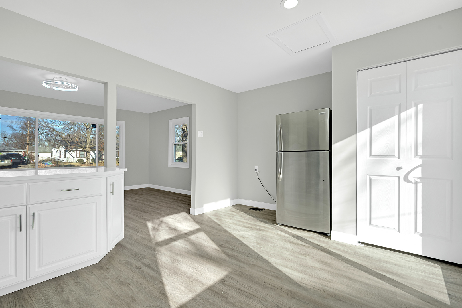 104 Louis Road Joliet, IL 60433 - Photo 8 of 11 a view of a refrigerator in kitchen and wooden floor
