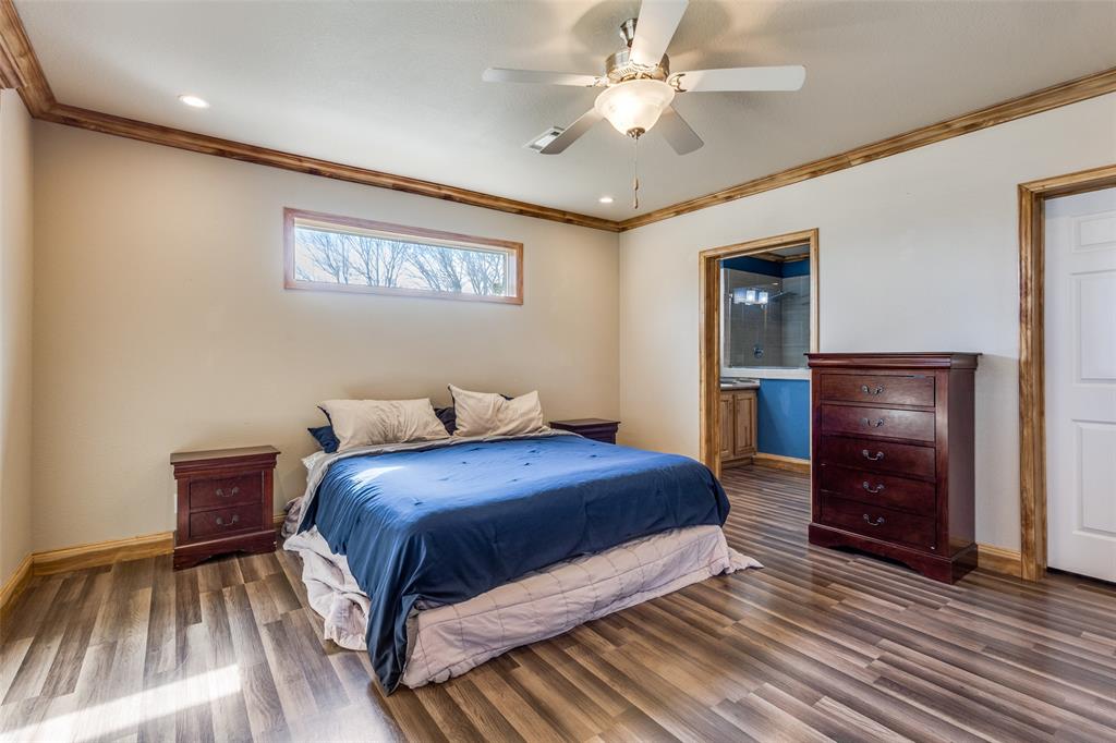 1425 Cowan Road Weston, TX 75009 - Photo 16 of 27 Primary bedroom with ensuite bathroom an separate closet.