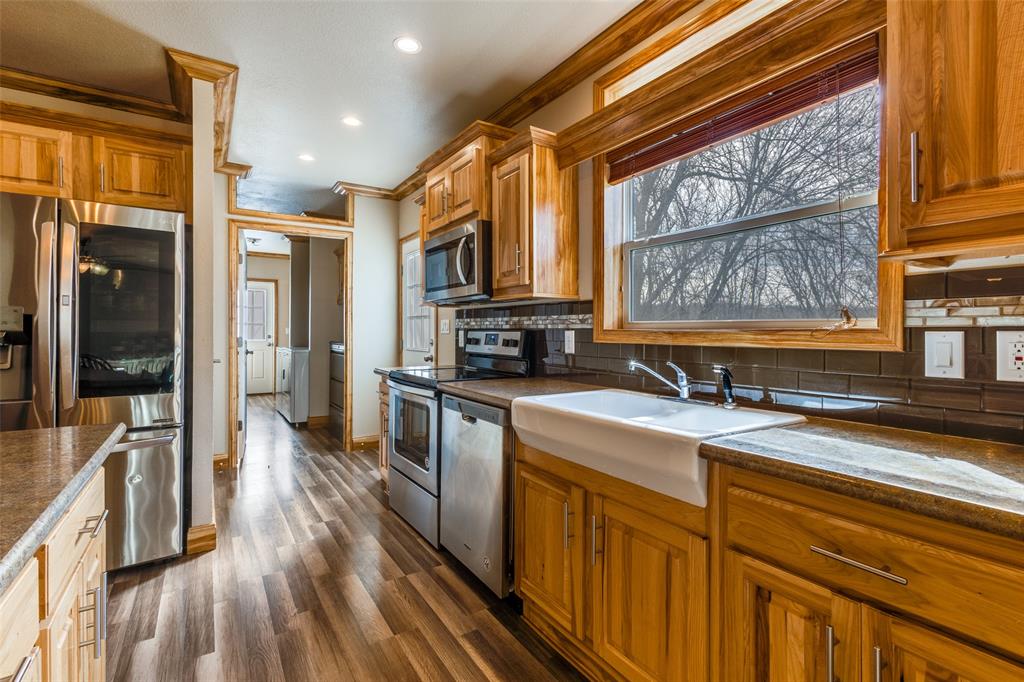 1425 Cowan Road Weston, TX 75009 - Photo 8 of 27 Kitchen with a large farm sink over looking big window.