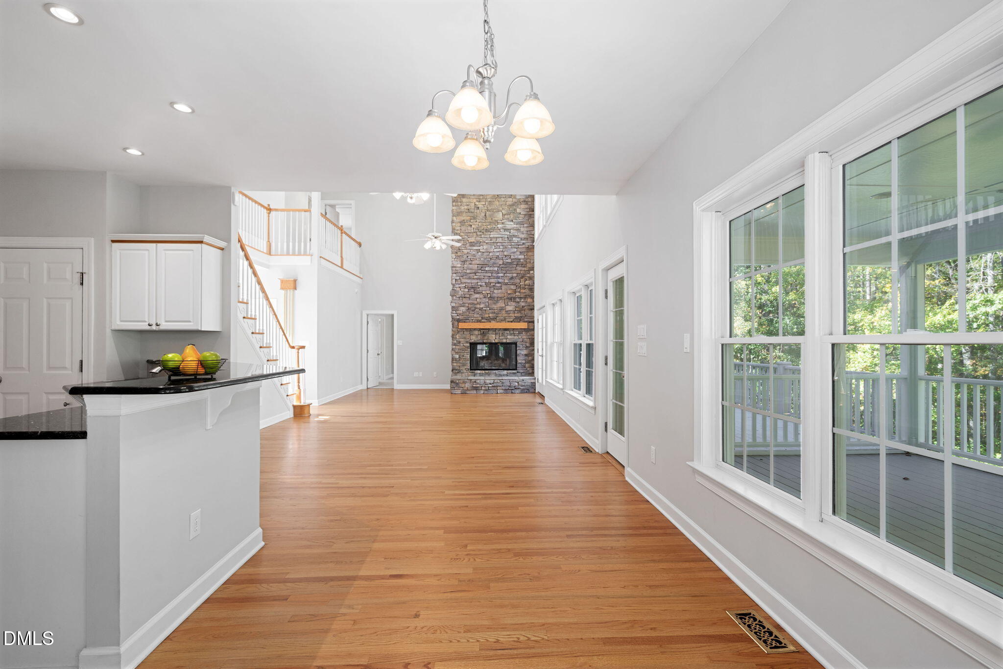 9916 Bonsal Crossing Road New Hill, NC 27562 - Photo 19 of 80 a view of a room with wooden floor and windows