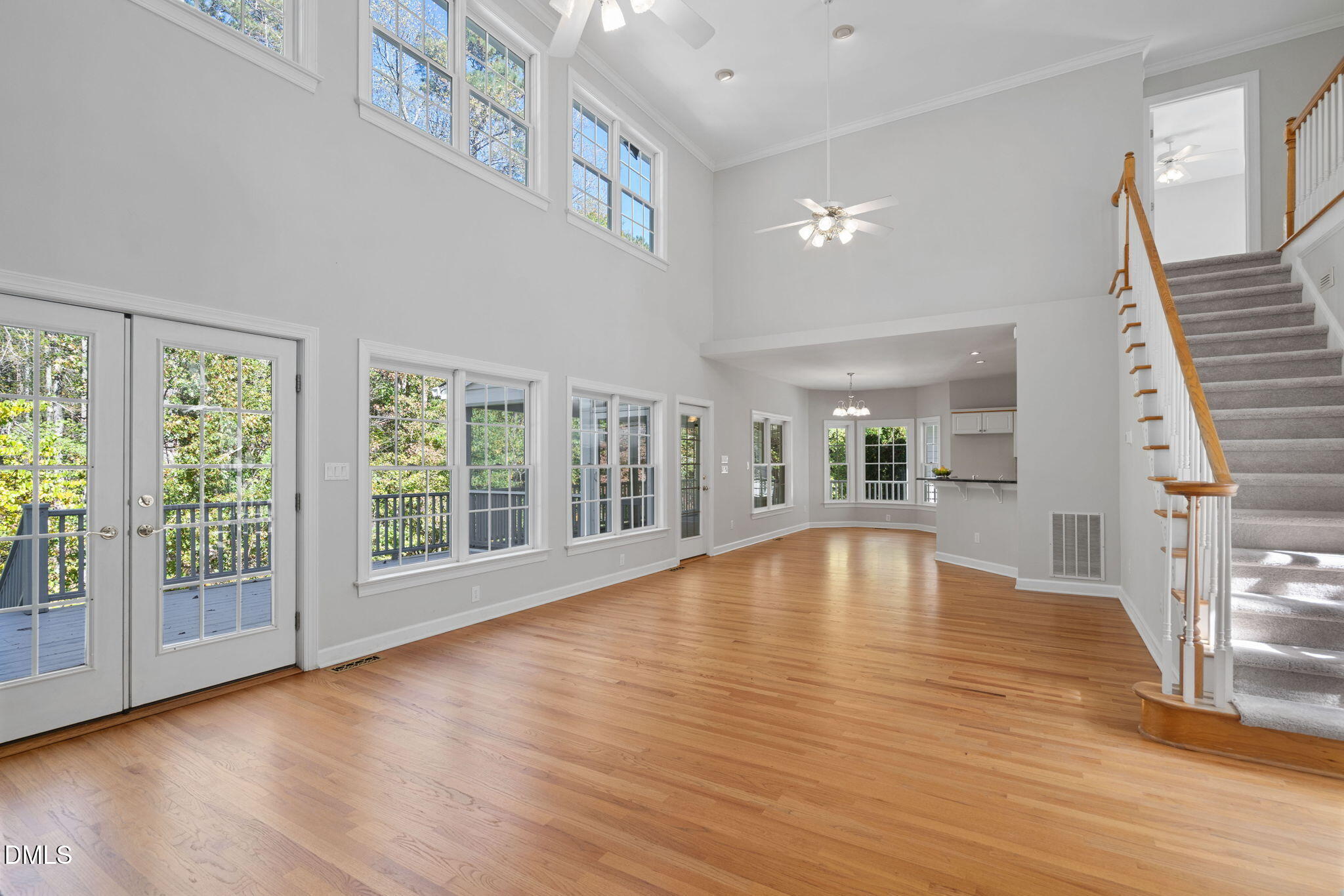 9916 Bonsal Crossing Road New Hill, NC 27562 - Photo 24 of 80 a view of empty room with wooden floor and fan