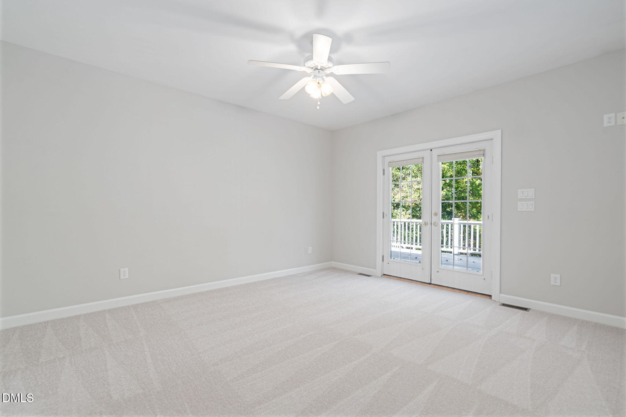 9916 Bonsal Crossing Road New Hill, NC 27562 - Photo 25 of 80 an empty room with a ceiling fan and window