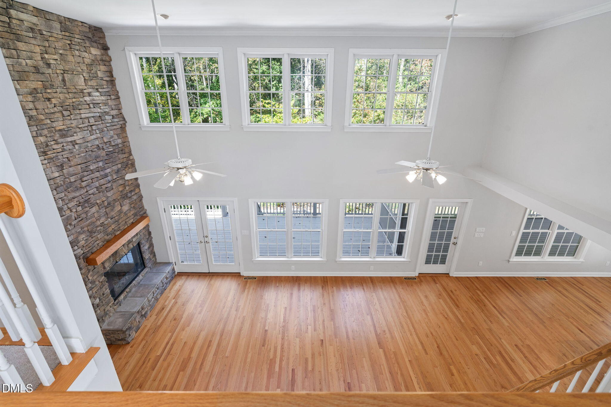 9916 Bonsal Crossing Road New Hill, NC 27562 - Photo 37 of 80 a view of an empty room with wooden floor and a window