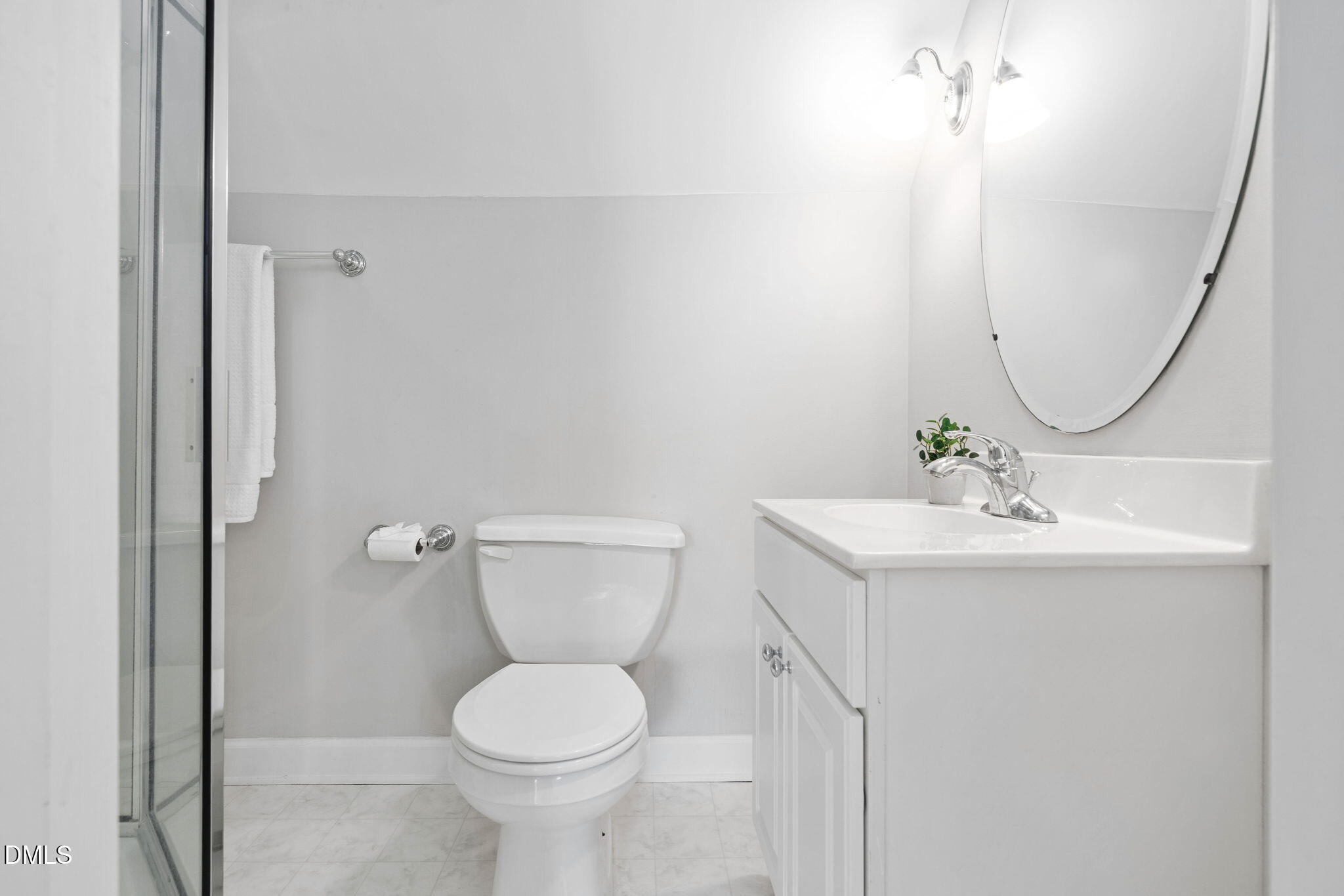 9916 Bonsal Crossing Road New Hill, NC 27562 - Photo 41 of 80 a bathroom with a toilet sink and mirror