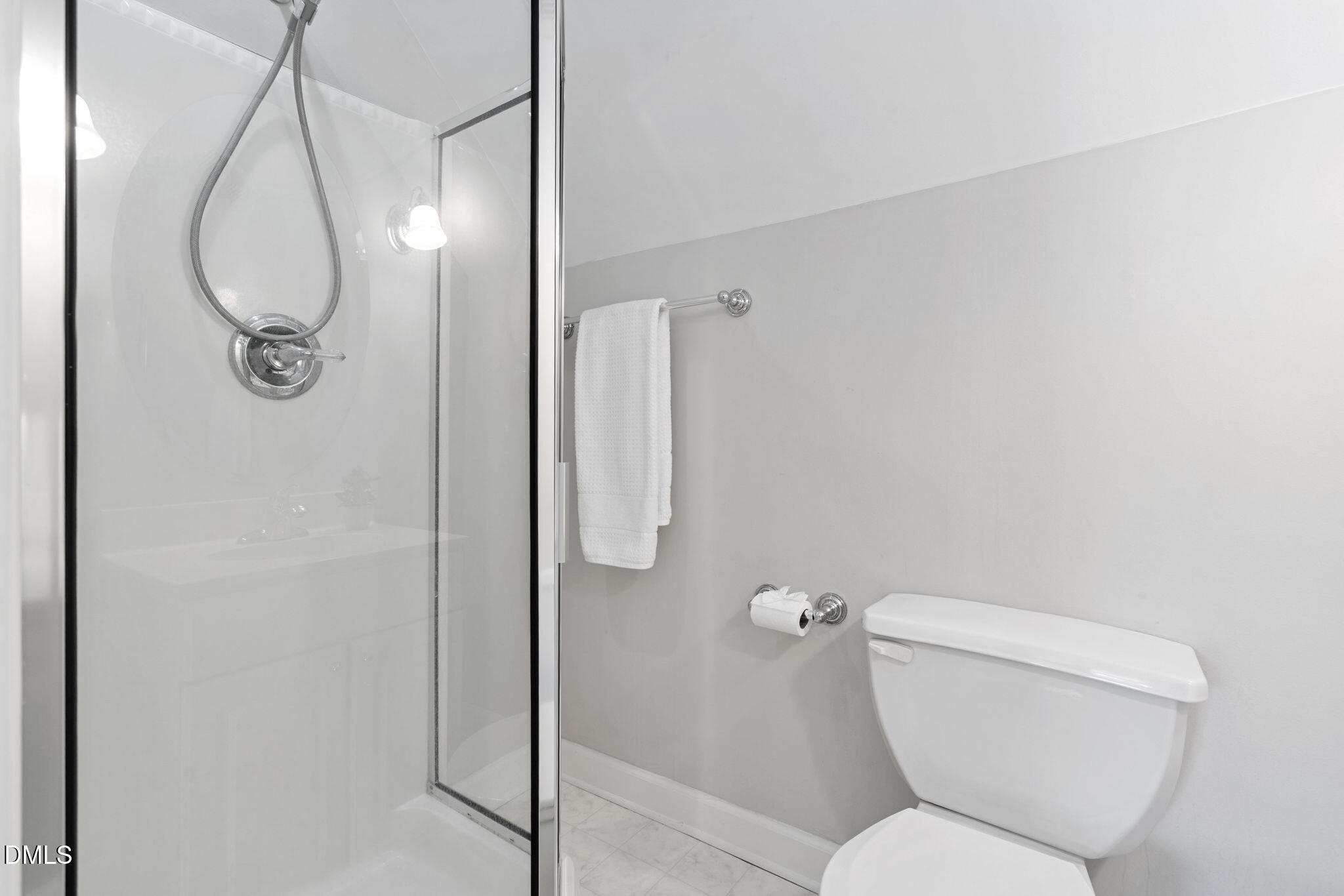 9916 Bonsal Crossing Road New Hill, NC 27562 - Photo 42 of 80 a white toilet sitting next to a bathroom sink