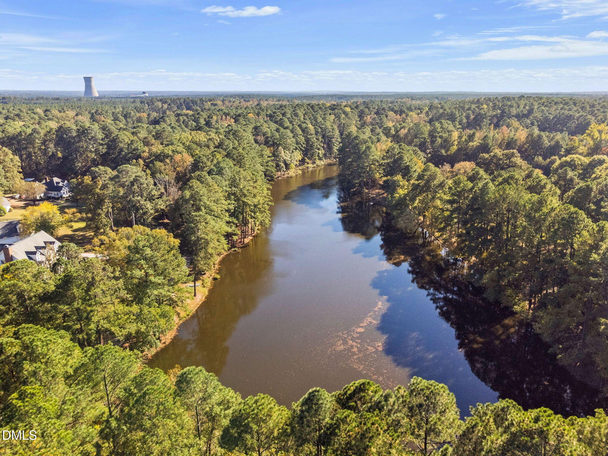 9916 Bonsal Crossing Road New Hill, NC 27562 - Photo 73 of 80 a view of a lake with mountains in the background