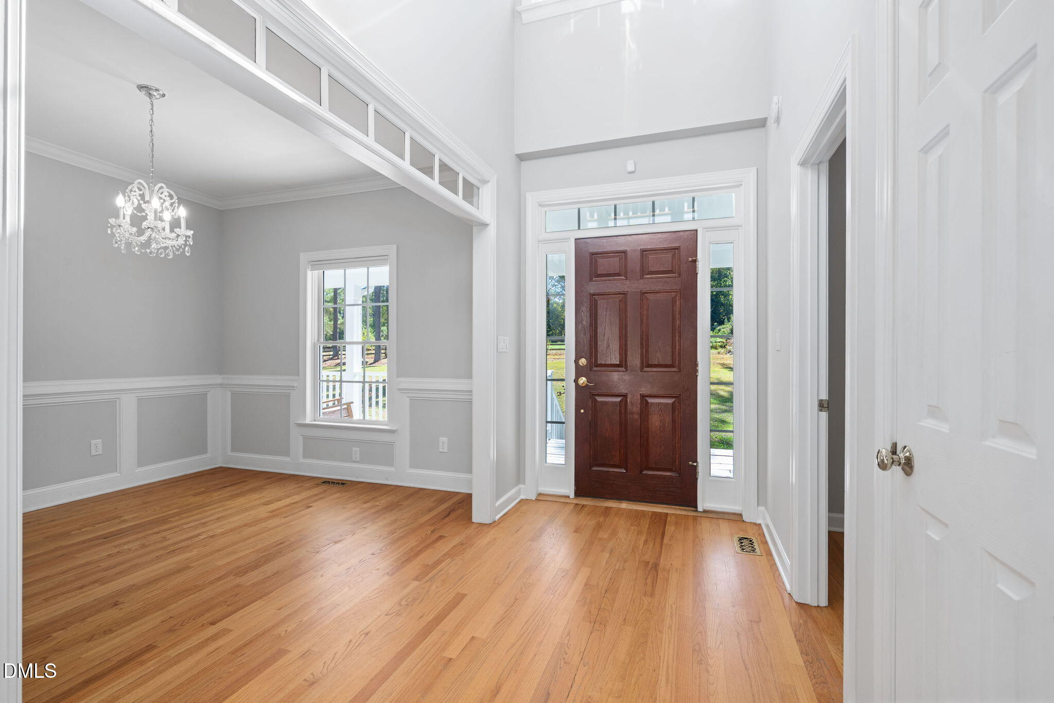 9916 Bonsal Crossing Road New Hill, NC 27562 - Photo 9 of 80 a view of livingroom with hardwood floor and window