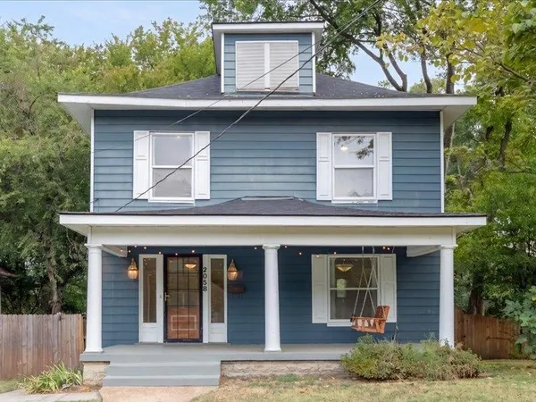 a front view of a house with garage