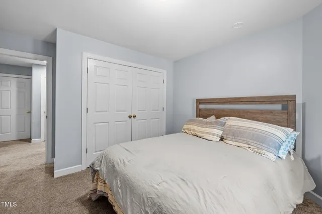 a bedroom with a bed and closet