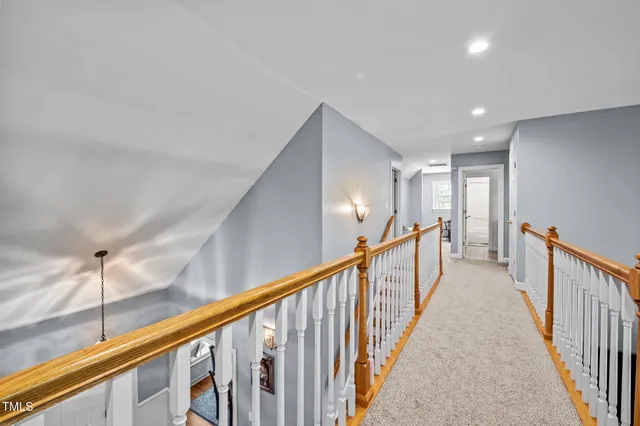 a view of a hallway with stairs