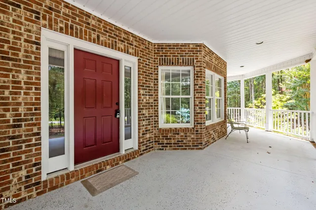 a view of backyard with large windows