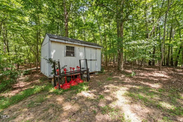 a view of backyard with deck and seating area