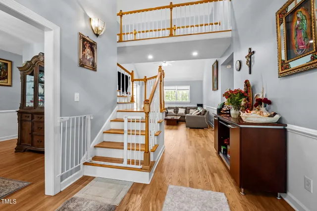 a view of entryway livingroom and hall with wooden floor