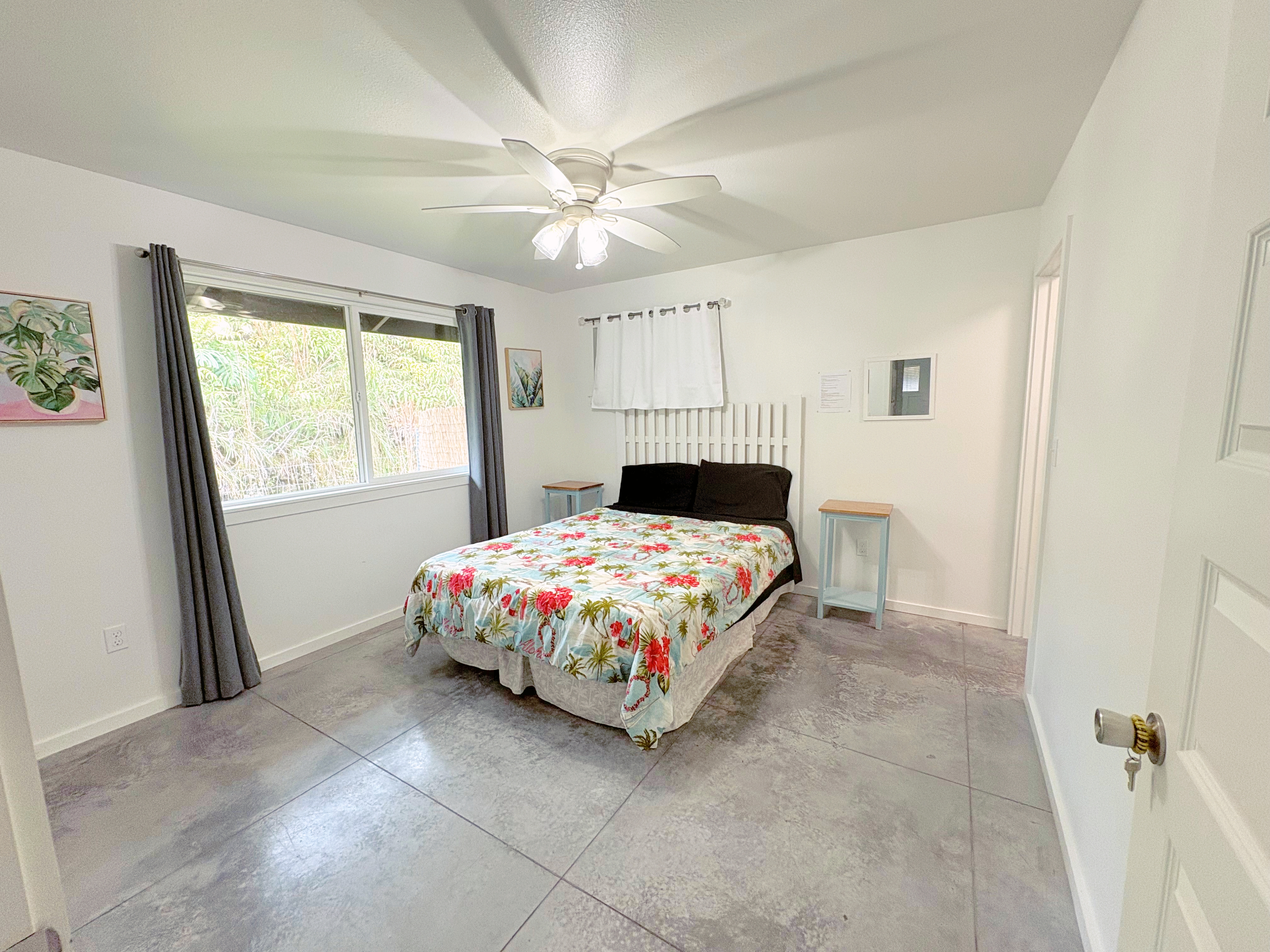 11-3083 Kaleponi Road Mountain View, HI 96771 - Photo 16 of 28 a bedroom with a bed and window