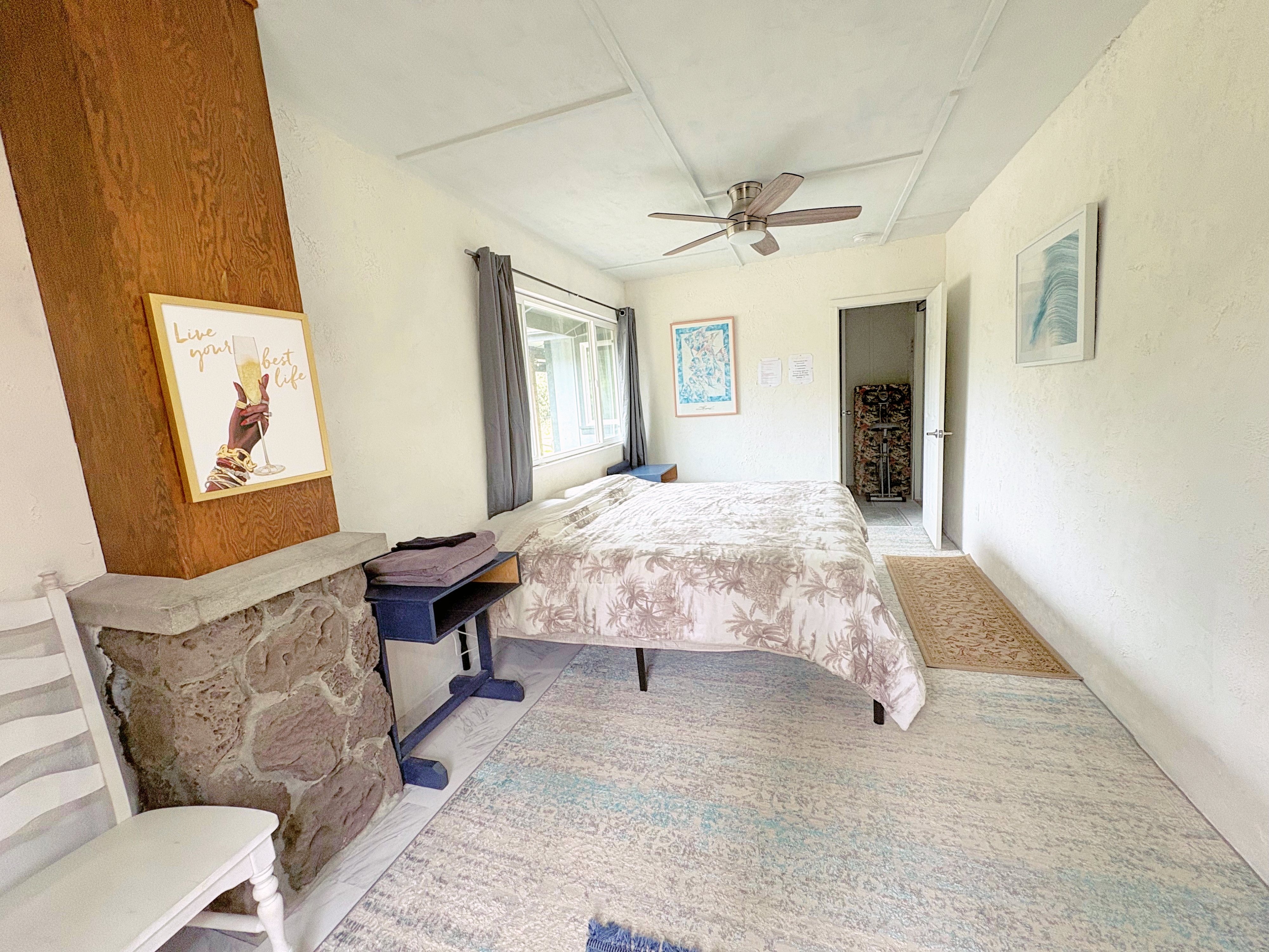 11-3083 Kaleponi Road Mountain View, HI 96771 - Photo 23 of 28 a bedroom with a bed couch and window