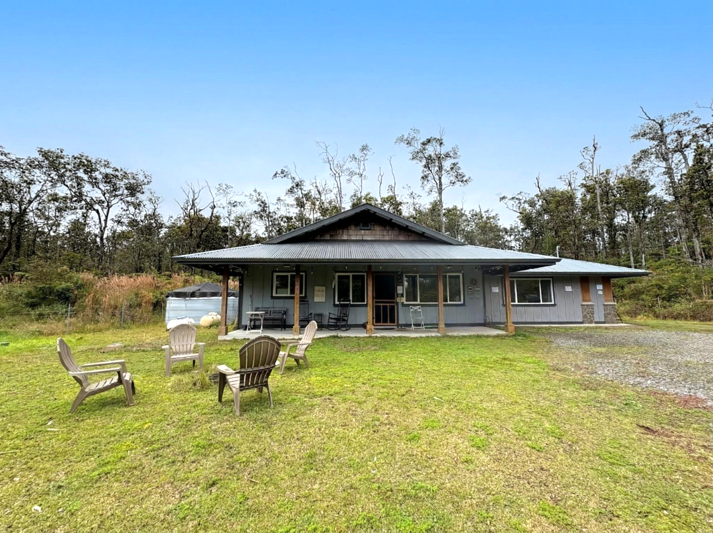 11-3083 Kaleponi Road Mountain View, HI 96771 - Photo 25 of 28 a swimming pool with outdoor seating and yard
