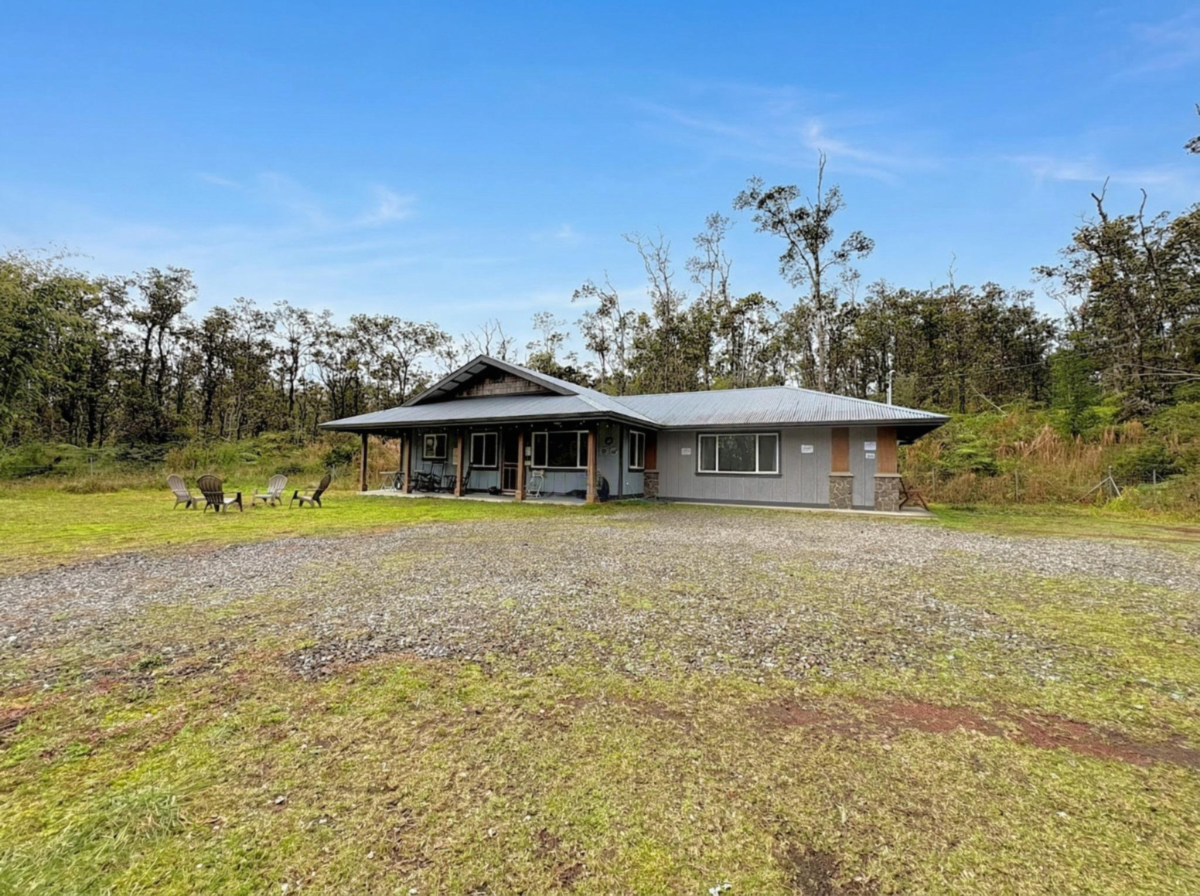 11-3083 Kaleponi Road Mountain View, HI 96771 - Photo 26 of 28 a front view of a house with a yard