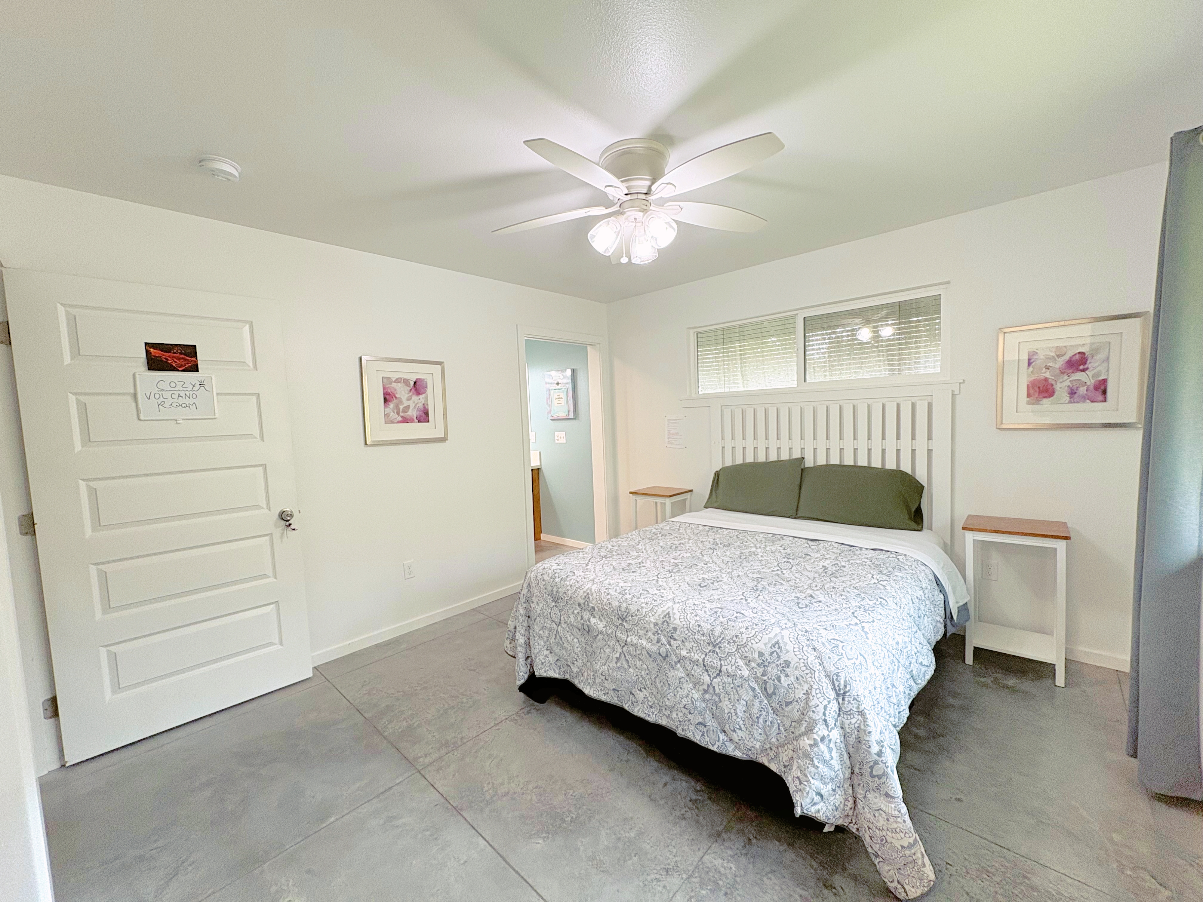 11-3083 Kaleponi Road Mountain View, HI 96771 - Photo 9 of 28 a bedroom with a bed and a chandelier