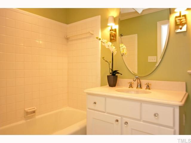 100 Byron Place Raleigh, NC 27609 - Photo 8 of 12 Hall bathroom has been upgraded but also features original tile.