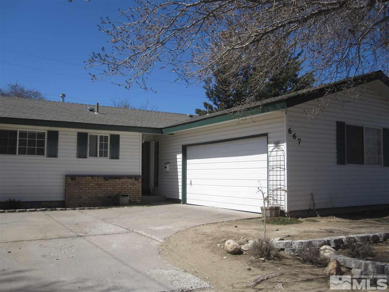 667 Beldon Way Reno, NV 89503 - Photo 1 of 13 a front view of a house with a yard