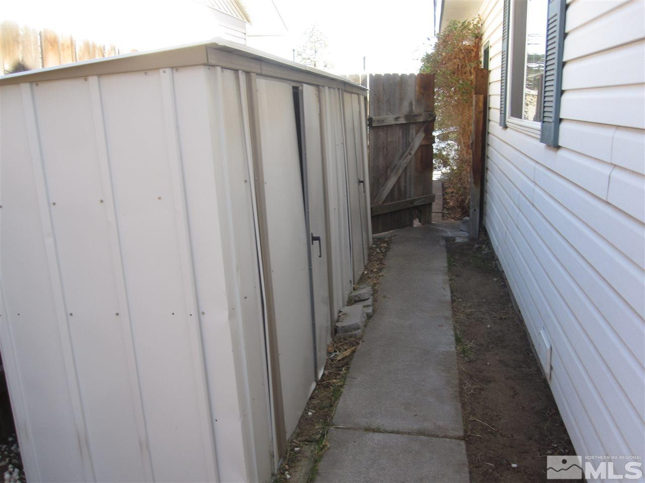 667 Beldon Way Reno, NV 89503 - Photo 12 of 13 a view of a house with a backyard