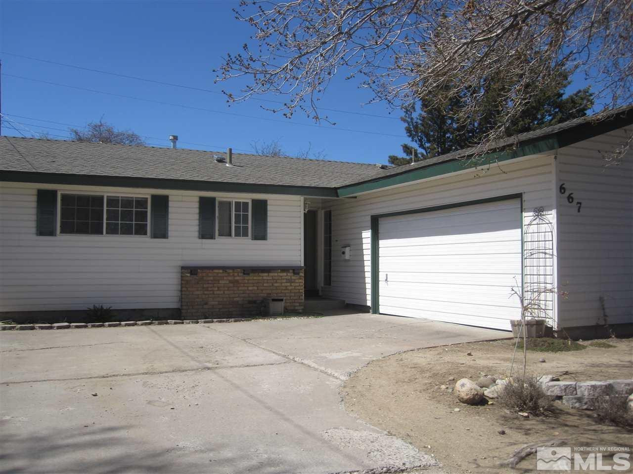 667 Beldon Way Reno, NV 89503 - Photo 2 of 13 a view of a house with a yard
