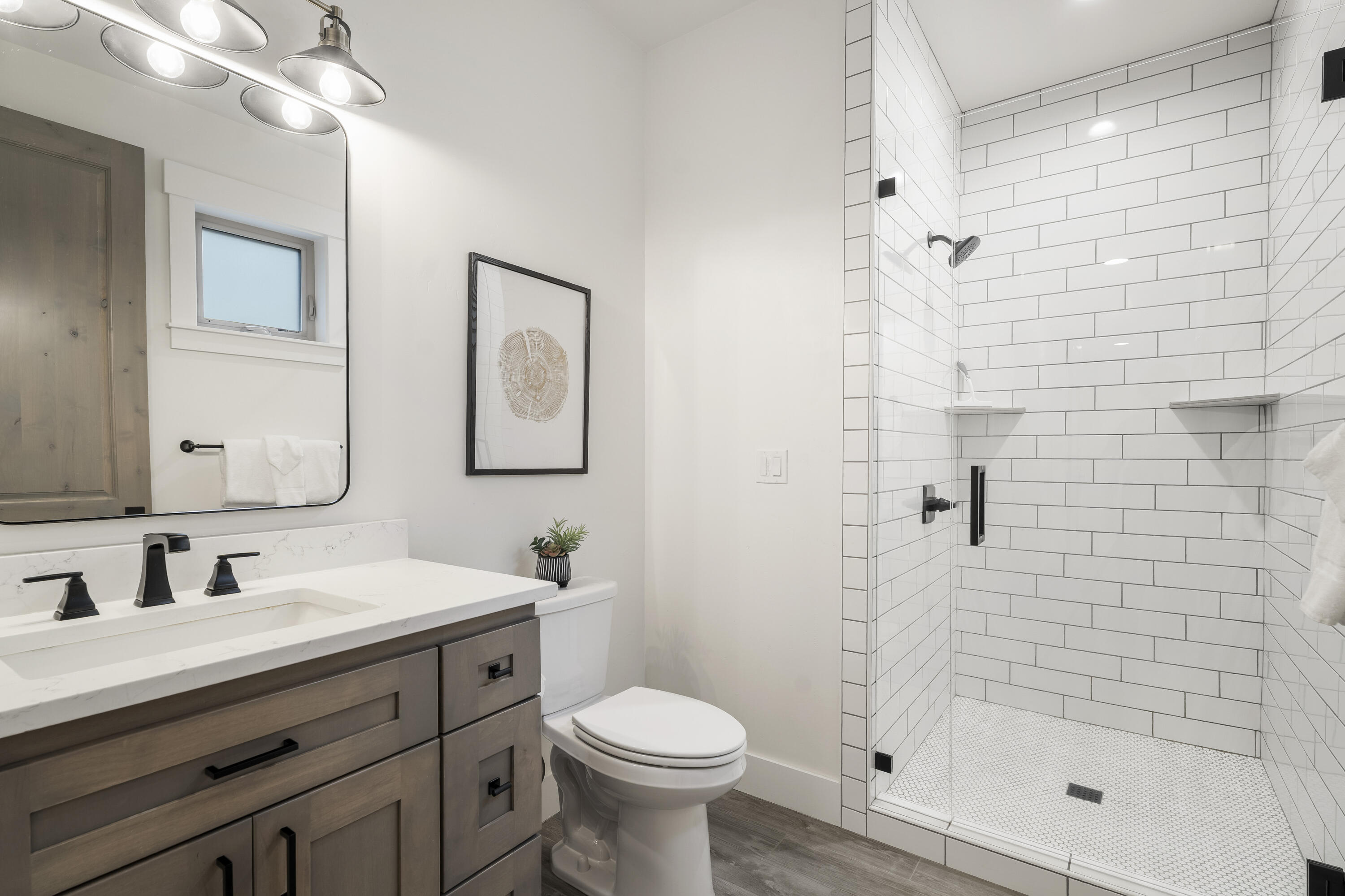 56302 Sable Rock Loop, Unit 255 Bend, OR 97707 - Photo 33 of 65 a bathroom with a sink toilet and shower
