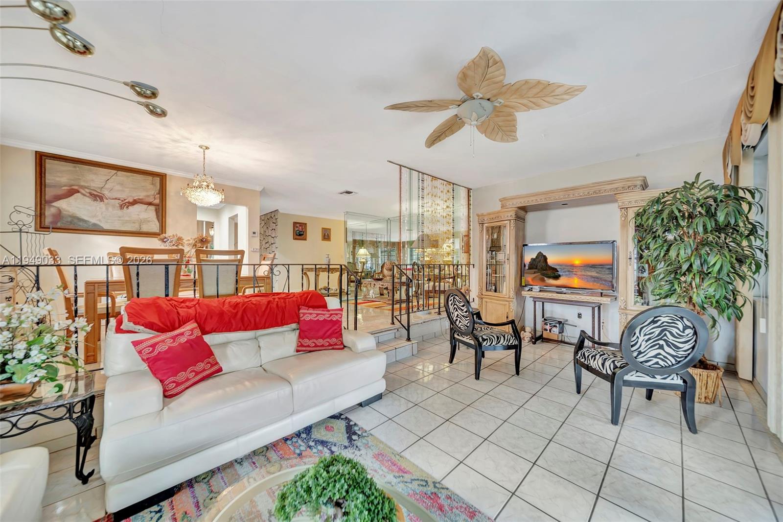 244 Northwest 43rd Street Miami, FL 33127 - Photo 12 of 29 a living room with furniture and a large window