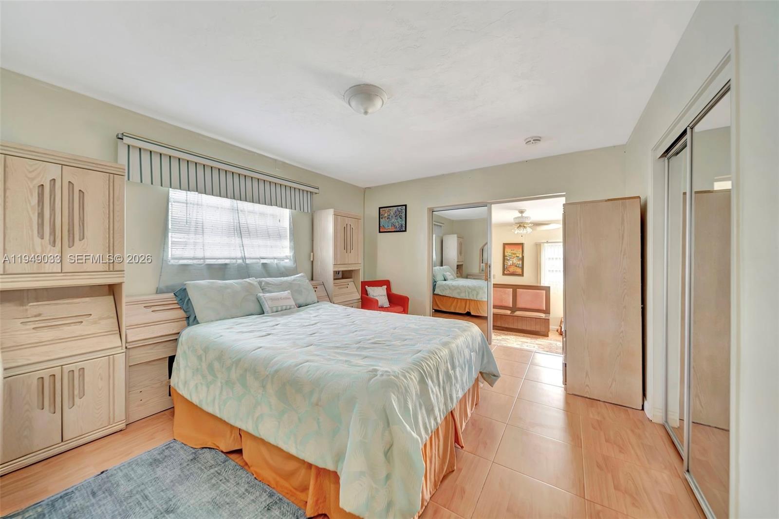 244 Northwest 43rd Street Miami, FL 33127 - Photo 13 of 29 a bedroom with a large bed and a window