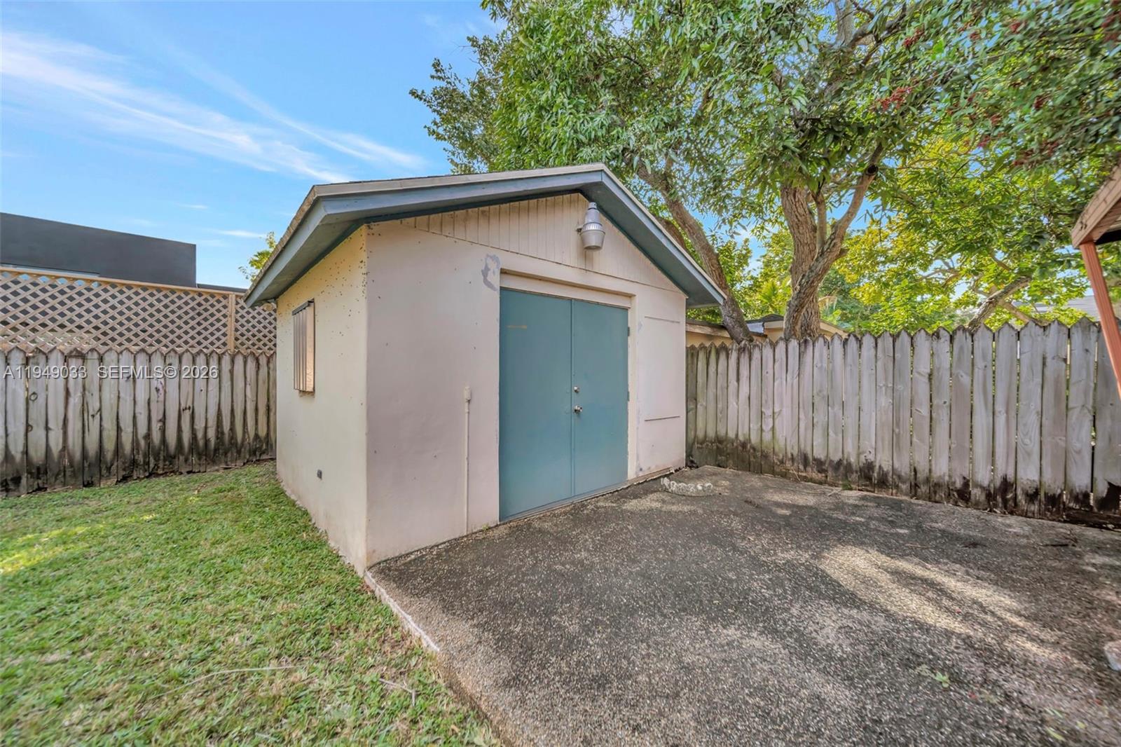 244 Northwest 43rd Street Miami, FL 33127 - Photo 24 of 29 a view of a backyard with wooden fence