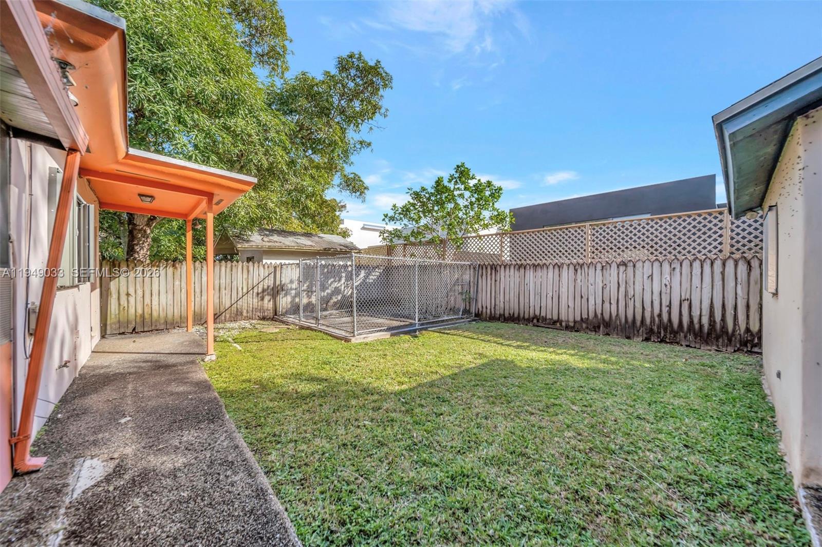 244 Northwest 43rd Street Miami, FL 33127 - Photo 25 of 29 a view of a backyard with a garden