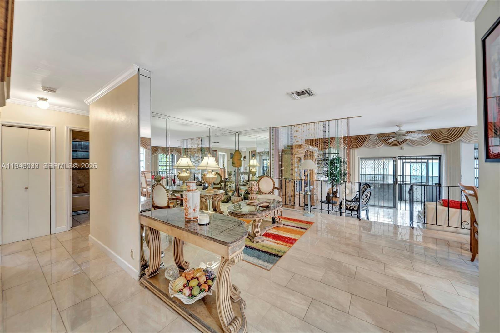 244 Northwest 43rd Street Miami, FL 33127 - Photo 3 of 29 a very nice looking room with a large window and furniture